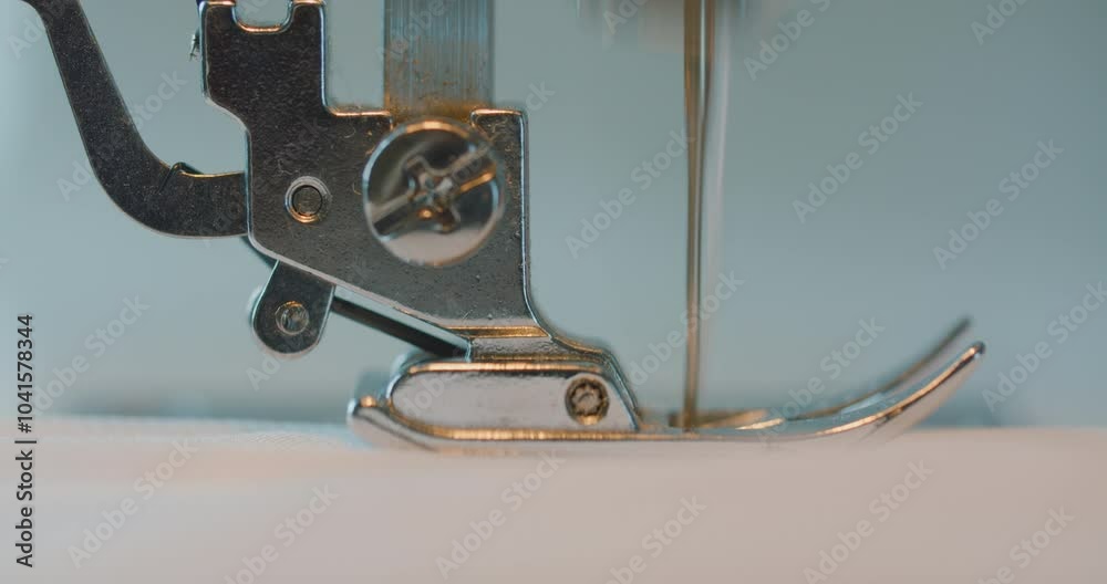 Close-up of a sewing machine foot, sew a seam.