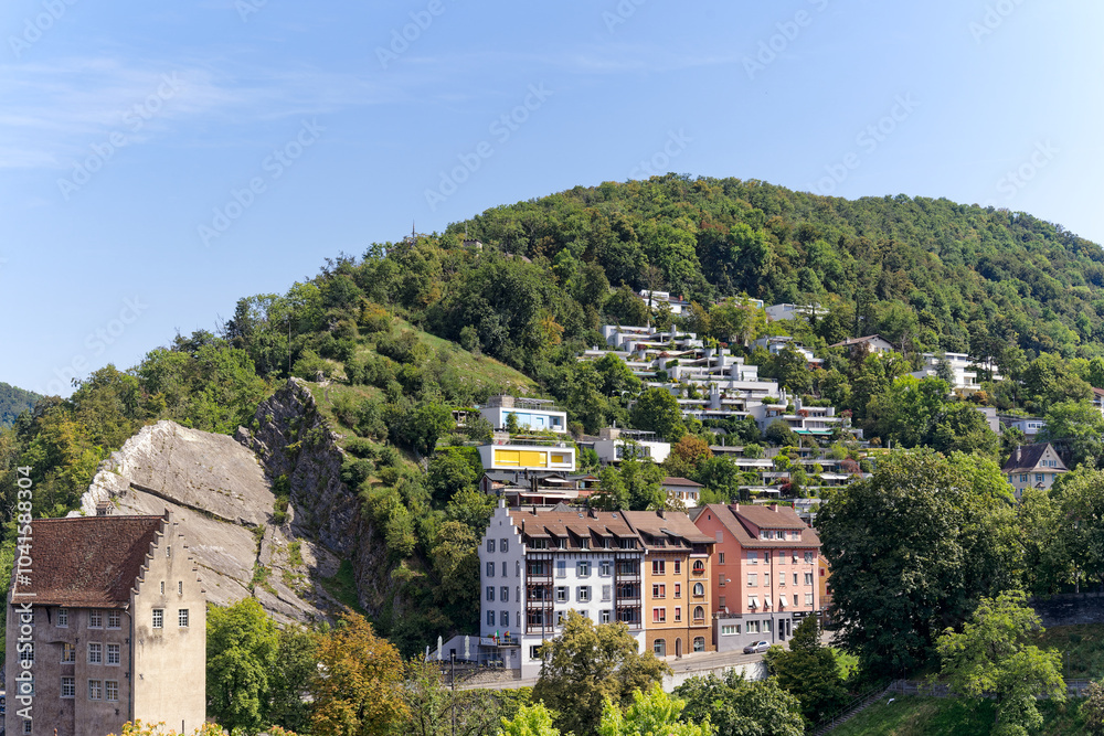Obraz premium Swiss City of Baden at fun fair named Badenfahrt with scenic view of residential district and terrace buildings on a sunny summer day. Photo taken August 19th, 2023, Baden, Canton Aargau, Switzerland.