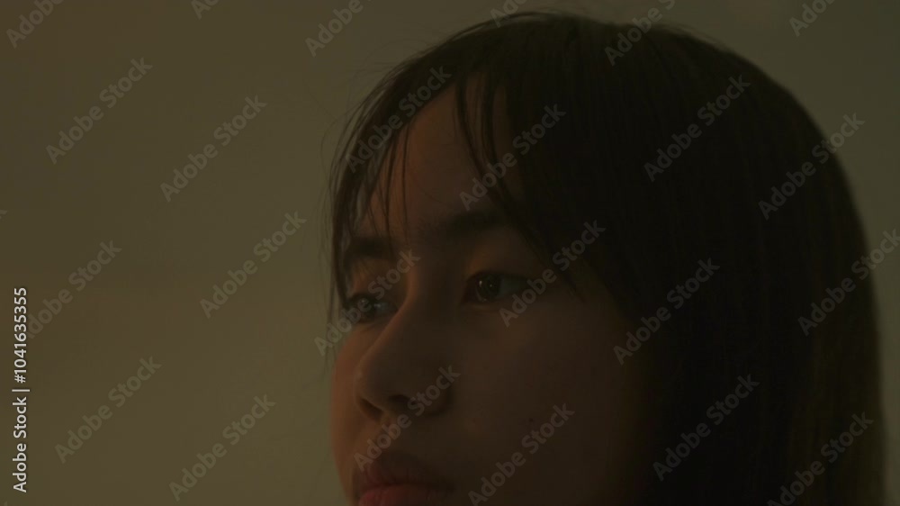 A Woman's Face, Pale and Strained, Carries a Distant Expression, Reflecting Signs of a Mental Health Struggle - Close Up A Woman's Face, Pale and Strained, Carries a Distant Expression, Reflecting Signs of a Mental Health Struggle - Close Up