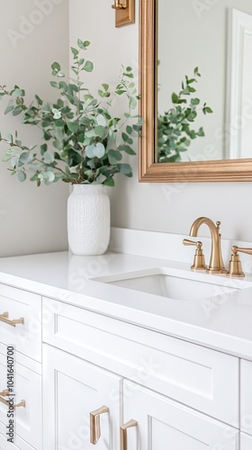 A bouquet of white peonies fills a glass vase on a white sideboard, accented by reed diffusers with black sticks, enhancing the aesthetic of modern interior design.