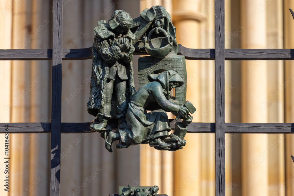 Figurines on metal fence of the Golden Gate of medieval St. Vitus Cathedral, Prague, Czech Republic