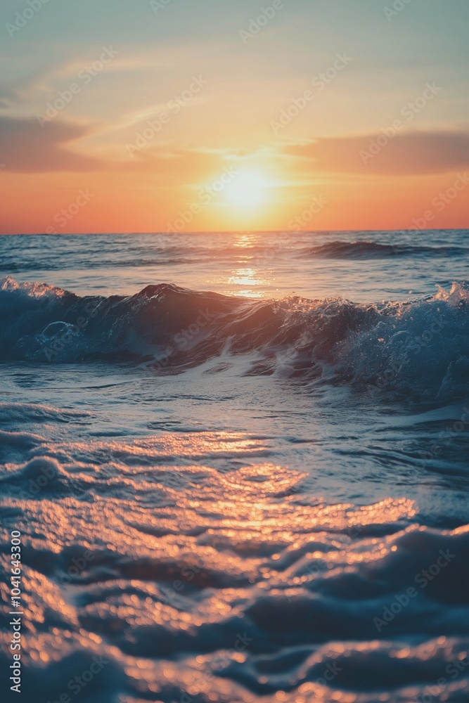 A sunset paints the sky orange, reflecting on gentle ocean waves in a tranquil scene. A sunset paints the sky orange, reflecting on gentle ocean waves in a tranquil scene.