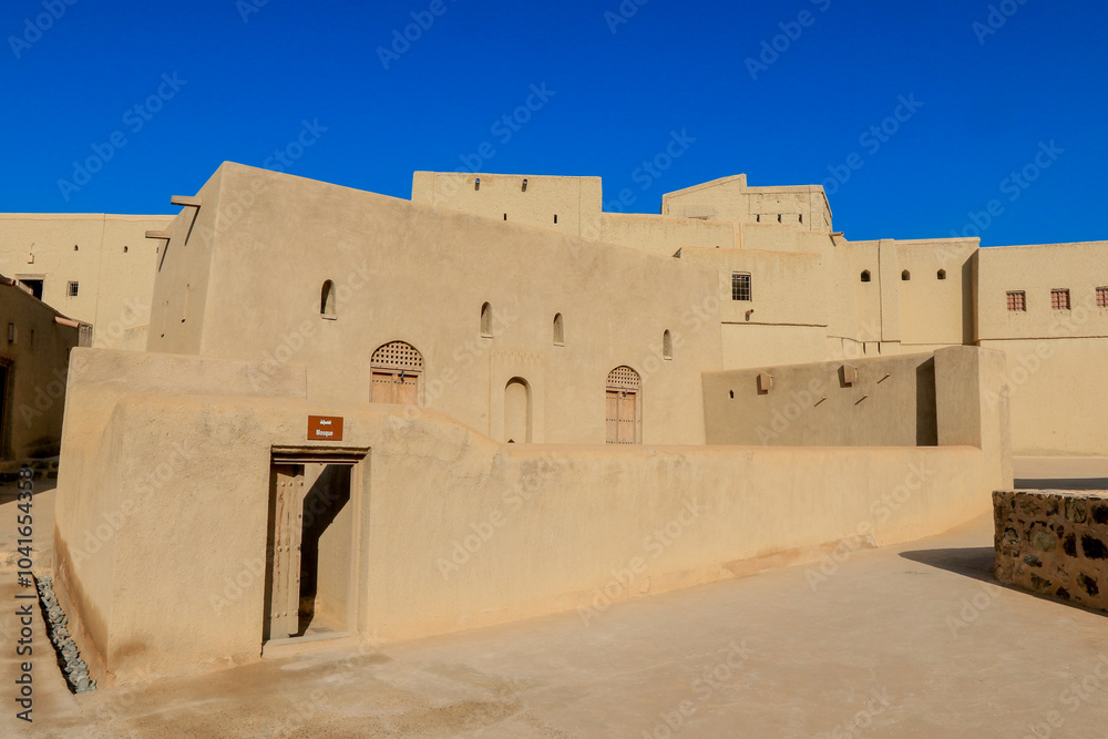 Bahla Fort in Oman showcasing ancient architecture and cultural heritage under a clear blue sky during the day Bahla Fort in Oman showcasing ancient architecture and cultural heritage under a clear blue sky during the day