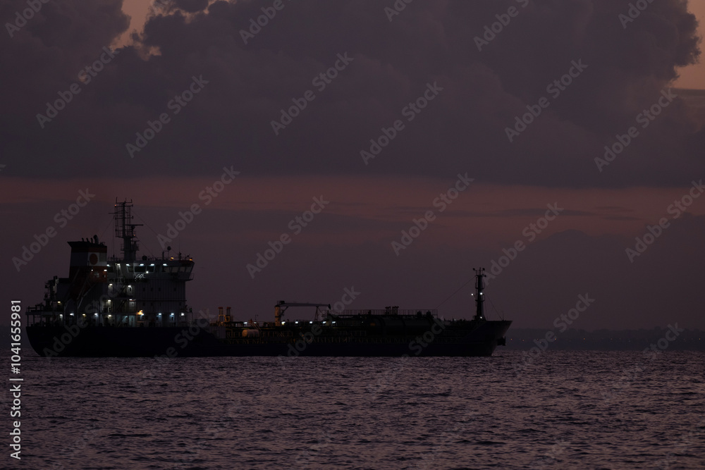 Ship anchored over the sea at dusk Ship anchored over the sea at dusk