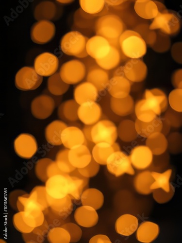 Golden blurred bokeh lights on black background glitter sparkle stars for celebrate overlay for your design glitter dust particle Ultra realistic 