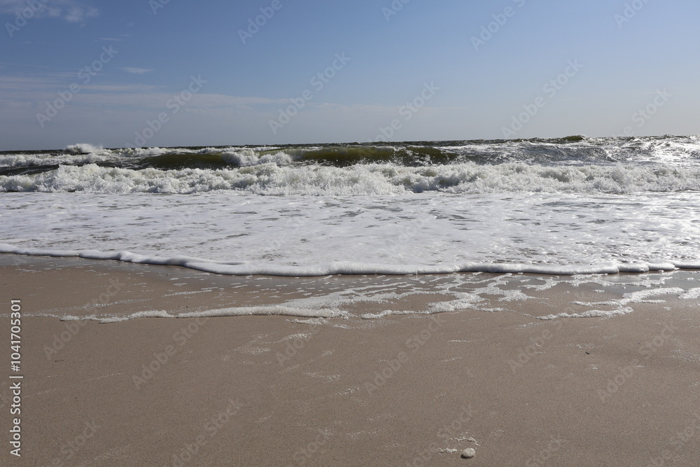 Ocean Waves Rolling onto Sandy Beach under Clear Sky Ocean Waves Rolling onto Sandy Beach under Clear Sky