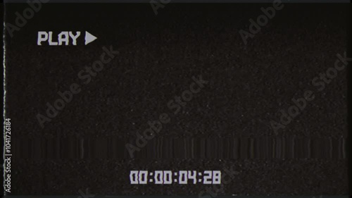 This is stock motion graphic shows a vintage VHS play screen overlay with timecode in a seamless loop. photo