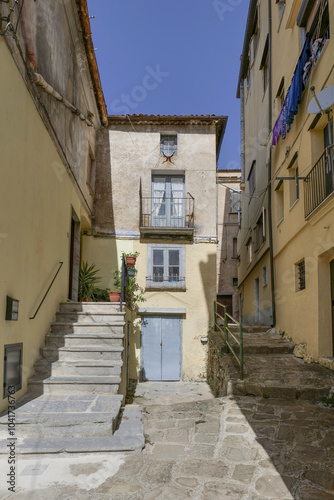 Fototapeta Naklejka Na Ścianę i Meble -   A small street among the old houses of a Moliterno, small town in Basilicata, Italy.