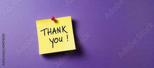 Thank you note pinned on purple background expressing gratitude