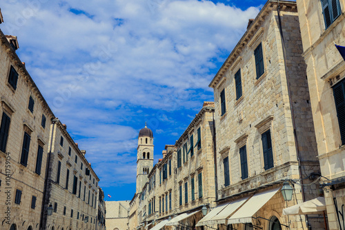Strolling through the historic streets of Dubrovnik Croatia under a clear blue sky on a sunny day
