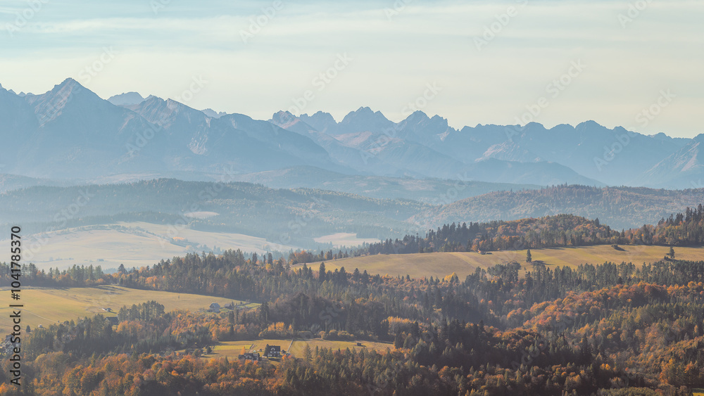 Beautiful autumn foggy mountain landscape. View towards the Tatra Mountains.