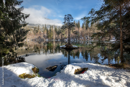 Mystical and peaceful Lake Cresta with snow in winter. photo