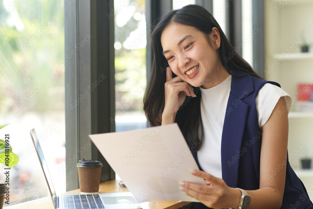 Asian woman succeeds at office Asian woman succeeds at office