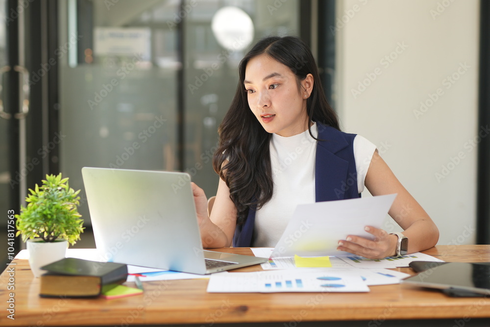 Asian woman succeeds at office Asian woman succeeds at office
