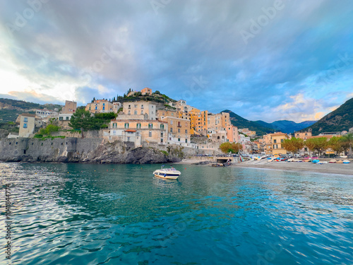 Minori old town and summer beach with umbrellas , Italy