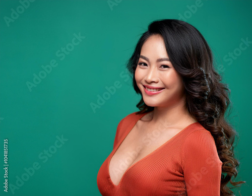 Portrait of Beautiful Young Woman Happily Smiling Against Studio Background