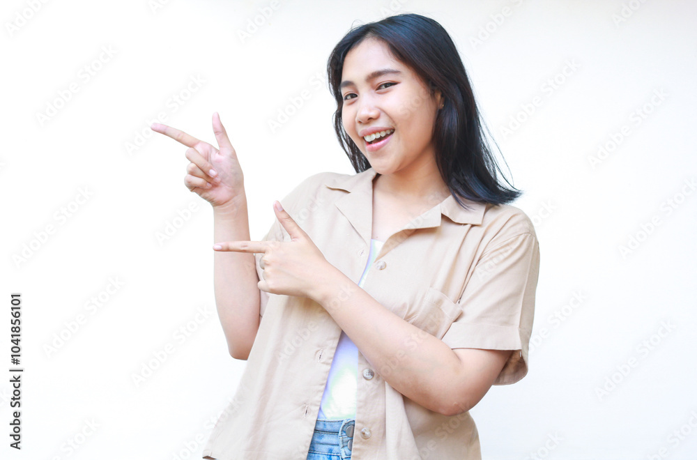 excited asian woman pointing finger showing presenting gesture wearing casual clothes isolated on white background excited asian woman pointing finger showing presenting gesture wearing casual clothes isolated on white background