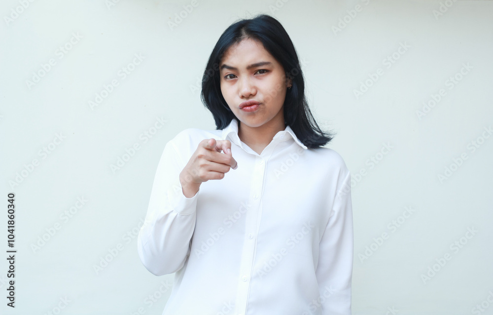 upset young asian woman office manager pointing to camera with unhappy face expression do blaming you gesture for mistakes problem wearing white formal shirt isolated om white background upset young asian woman office manager pointing to camera with unhappy face expression do blaming you gesture for mistakes problem wearing white formal shirt isolated om white background