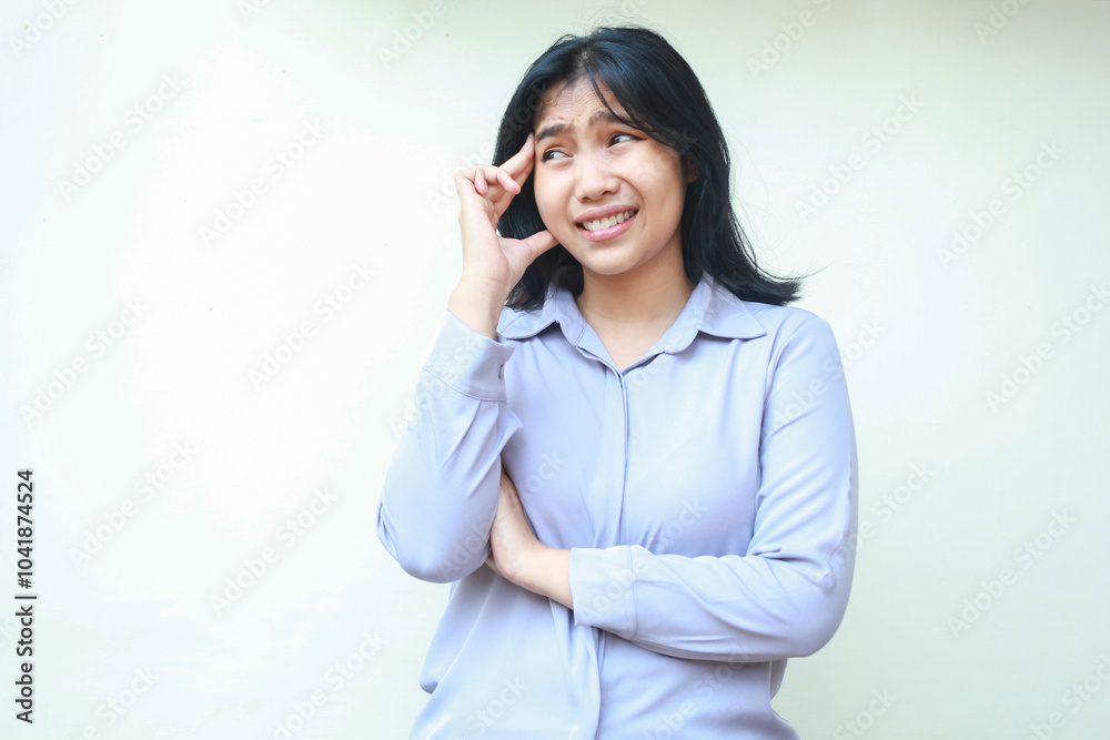 frustrated attractive asian business woman touching head with arm folded and daydream looking away worried isolated over white background frustrated attractive asian business woman touching head with arm folded and daydream looking away worried isolated over white background