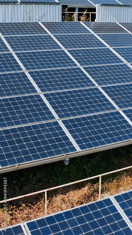 Sunbeams reflect on innovative solar cells. Blue photovoltaic solar panels receive clean energy from the sun. Green alternative energy. Vertical video Sunbeams reflect on innovative solar cells. Blue photovoltaic solar panels receive clean energy from the sun. Green alternative energy. Vertical video