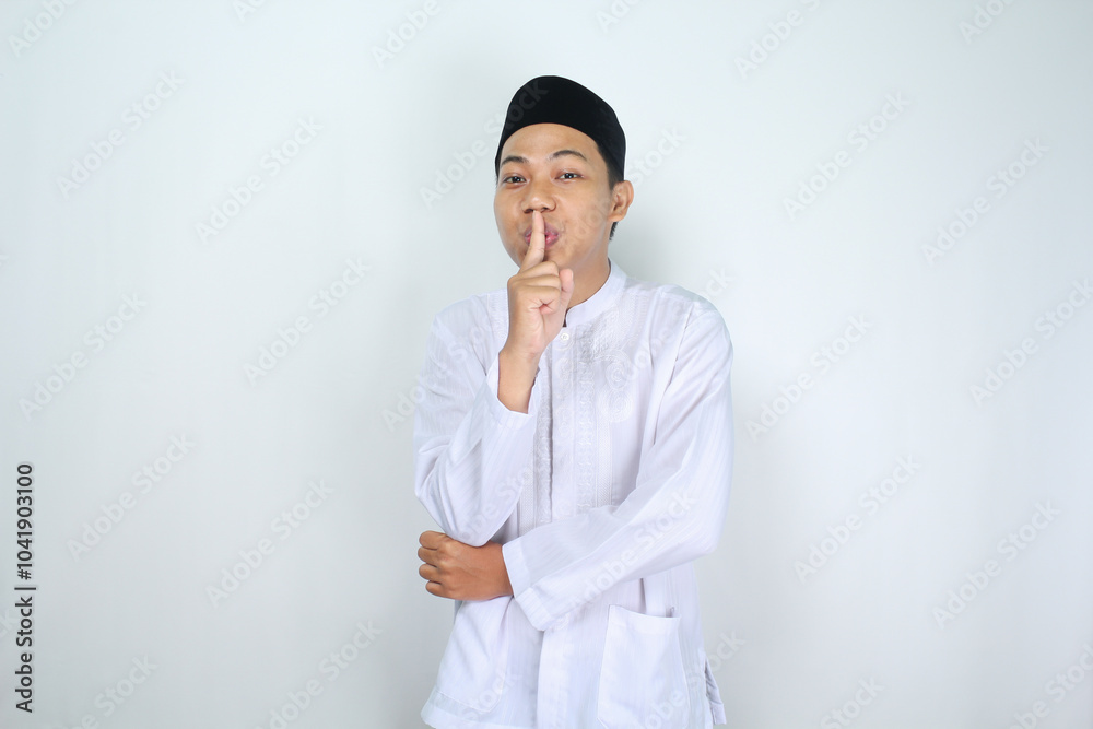 attractive muslim man asian show silent gesture isolated on white background attractive muslim man asian show silent gesture isolated on white background