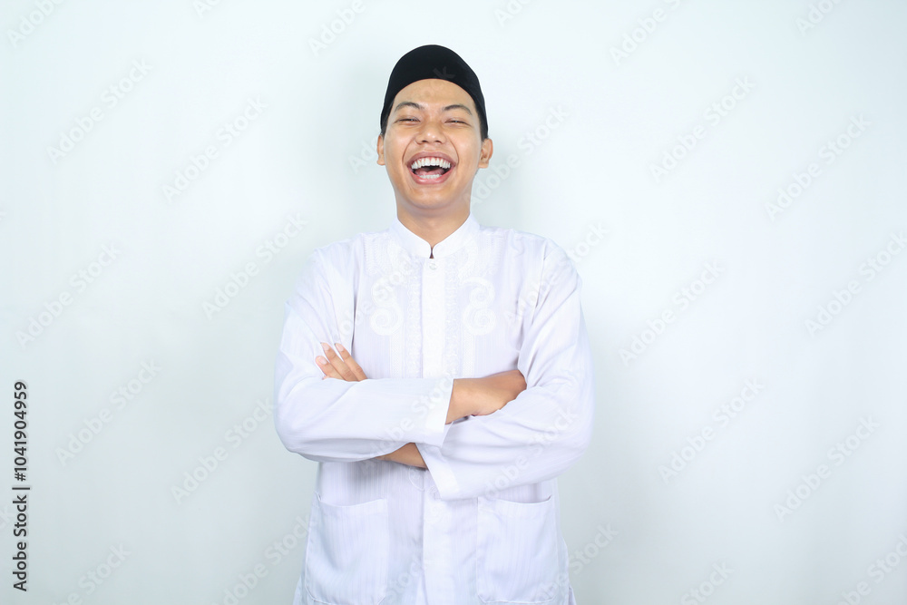 asian muslim man laughing with folded arm isolated on white background asian muslim man laughing with folded arm isolated on white background