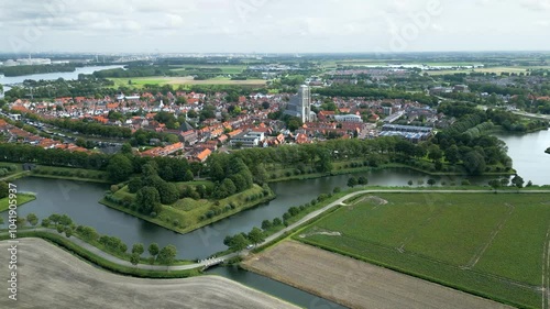 beautiful fortified town brielle netherlands 17th century church fortifications river flows through historic aerial panning shot view historical architecture townscape dutch history  photo