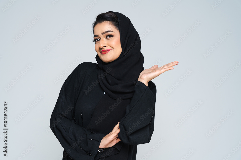 Beautiful arab middle-eastern woman with traditional abaya in studio Beautiful arab middle-eastern woman with traditional abaya in studio