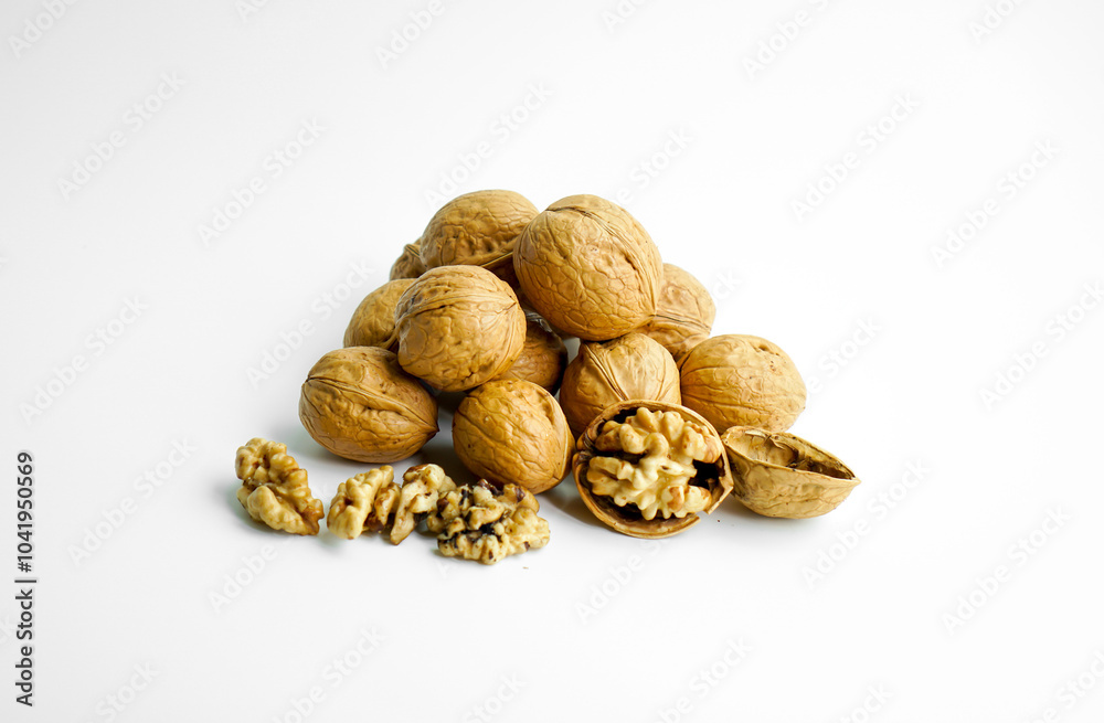 Ripe dry split walnut. Walnuts Isolated on White Background. closeup of shelled organic walnut halves. walnut, nut, full depth of field Ripe dry split walnut. Walnuts Isolated on White Background. closeup of shelled organic walnut halves. walnut, nut, full depth of field