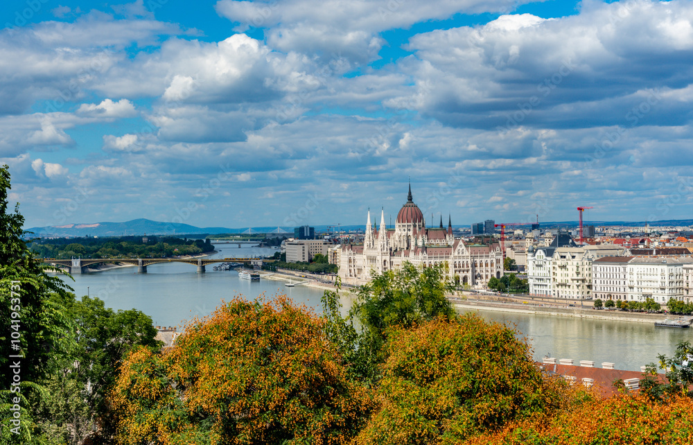 Naklejka premium View of the Hungarian Parliament Across the Danube River in Pest from Buda Castle in Budapest, Hungary.
