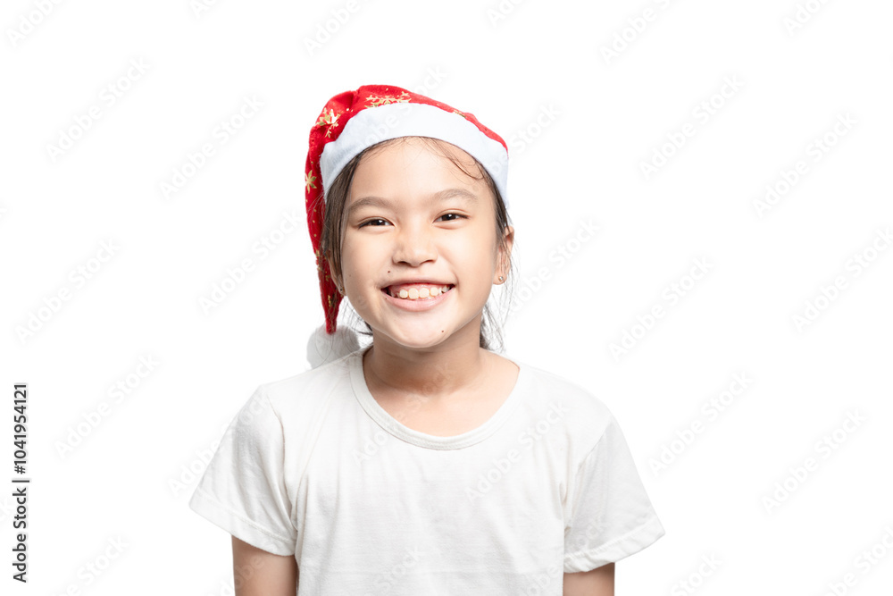 A young girl wearing a red Santa hat and smiling A young girl wearing a red Santa hat and smiling