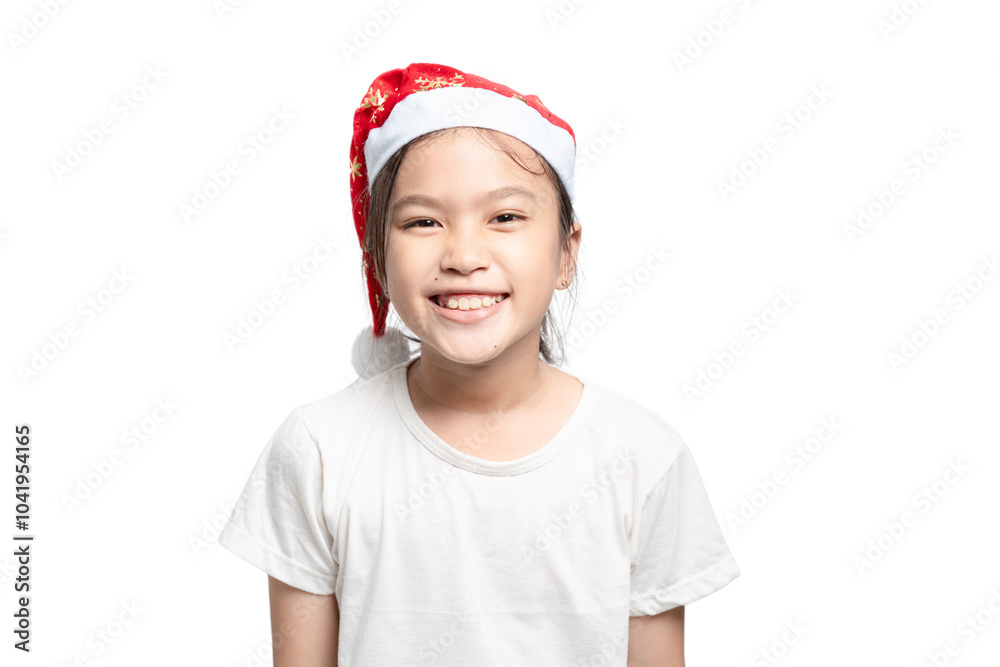 A young girl wearing a red Santa hat and smiling A young girl wearing a red Santa hat and smiling