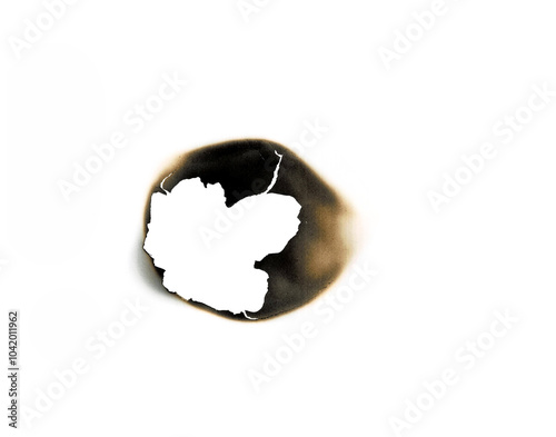 The fire burned hole in the white paper on a transparent background