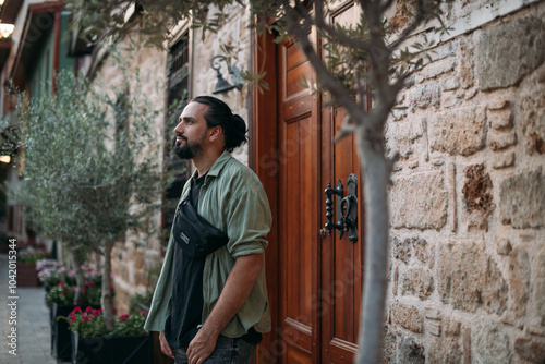 Portrait of a male tourist on a picturesque street of the old town.