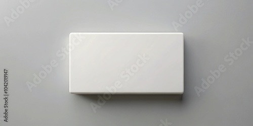 White rectangular object on gray surface