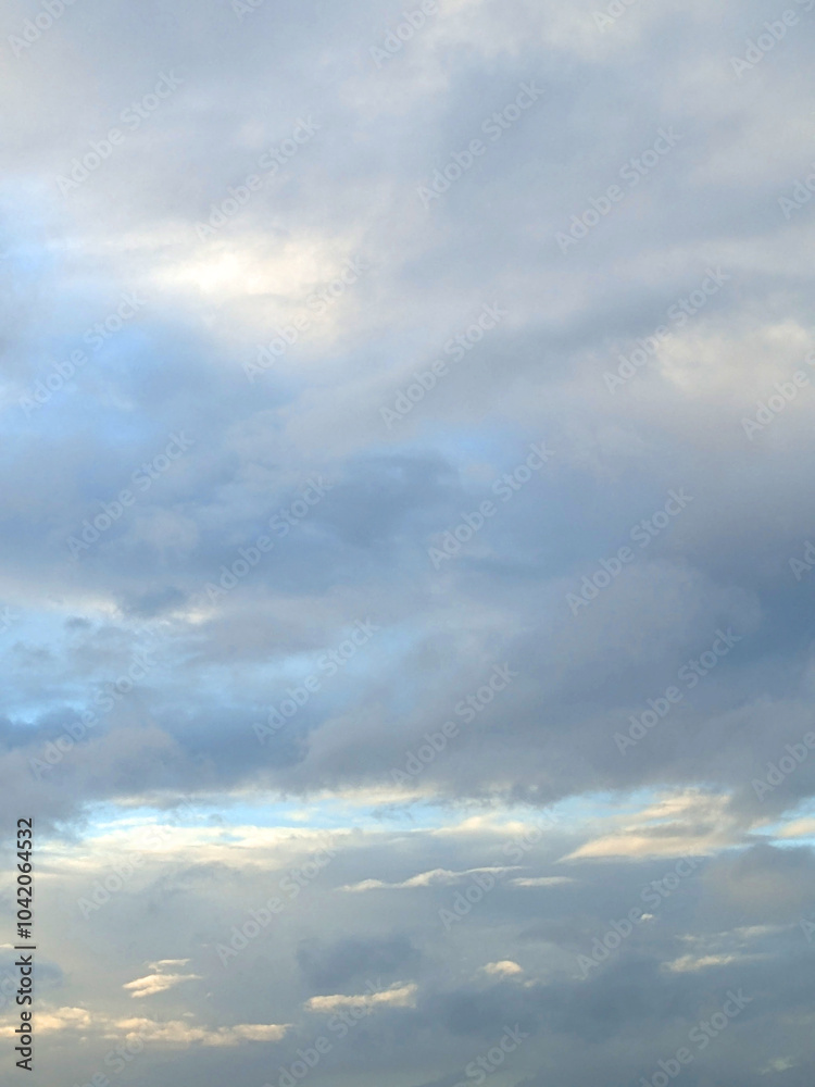 Fluffy White Clouds in a Blue Sky as A Skyscape Background Fluffy White Clouds in a Blue Sky as A Skyscape Background