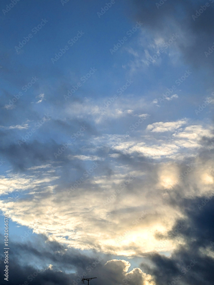 Fluffy White Clouds in a Blue Sky as A Skyscape Background Fluffy White Clouds in a Blue Sky as A Skyscape Background