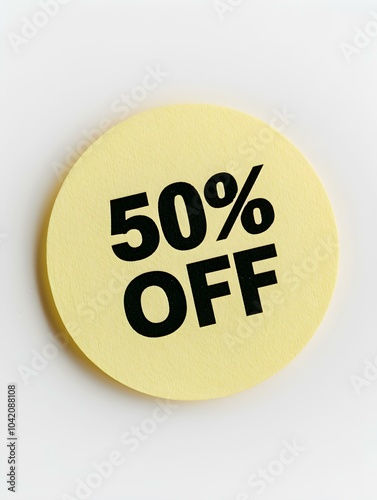 Black '50% OFF' Text on a Light Yellow Round Paper Note. White Background 