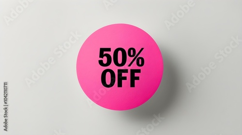 Black '50% OFF' Text on a Hot Pink Round Paper Note. White Background with Copy Space