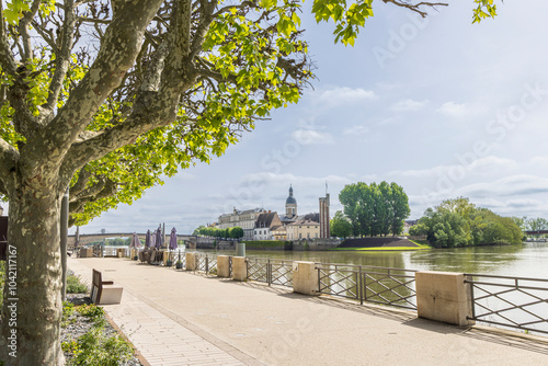 Boulevard along Saone river with view on island Saint-Laurent and our du Doyenne in Chalon-sur-Saone in Bourgogne region in France photo