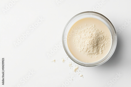 A close-up view of a glass bowl filled with fine powder on a clean white surface, showcasing the texture and color. Generative AI