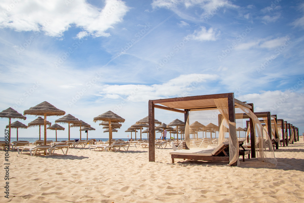 beds and umbrellas on the beach beds and umbrellas on the beach