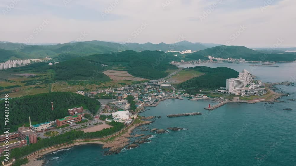 BUSAN, SOUTH KOREA - OCTOBER 19, 2024: Scenic aerial view of coastal landscape and modern buildings by the shore of Busan BUSAN, SOUTH KOREA - OCTOBER 19, 2024: Scenic aerial view of coastal landscape and modern buildings by the shore of Busan
