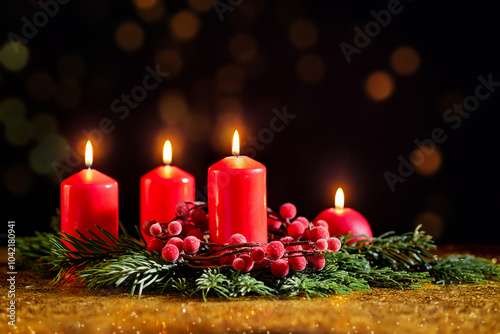 Obraz na płótnie Four red Christmas candles on a dark background w salonie