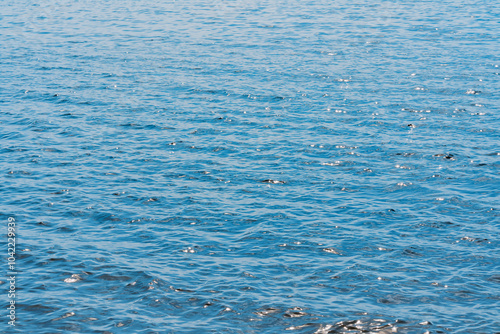 Calm ripple on water surface. River, lake, pond, sea pure blue water.