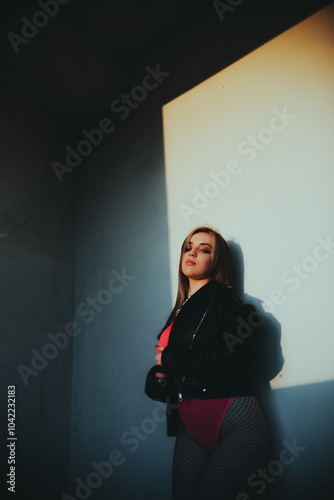 Stylish young woman posing in an abandoned room