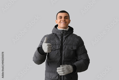 Young man in puffer jacket ...