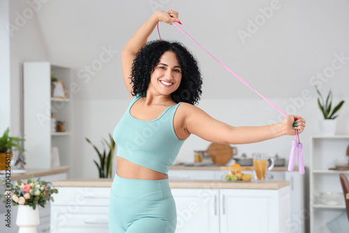Sporty adult woman with ski...