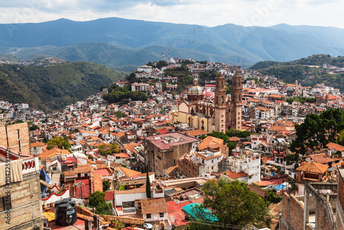 Aerial view over Pueblo Magico of Taxco, which rose to prominence in the 18th century, is one of Mexico's most scenic towns with Santa Prisca church. Taxco, Guerrero, Mexico