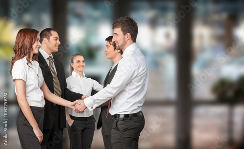 Young business people handshake for teamwork in project.